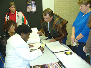 Percy Signs Books For The Attendees